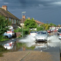 Another evening a flash rainstorm flooded the roads and some of the houses on this road!